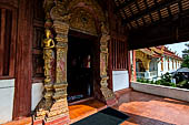 Chiang Mai - The Wat Phra Singh temple. Entrance door of the ubosot (ordination hall). 